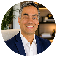 Portrait of Rodrigo, founder of The Coliving Academy, smiling in a navy blazer